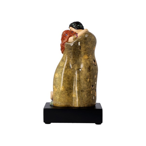 Goebel „The Kiss“ пресъздава легендарната „Целувка“ на Gustav Klimt като изящна триизмерна порцеланова композиция. Фигурата от колекцията Artis Orbis е висока 18 см, декорирана с истинско злато и поставена върху елегантен тъмен постамент. Впечатляващ арт обект и символичен подарък за любов, сватба, годишнина или ценител на изкуството.