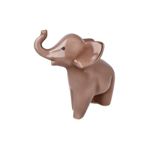 Goebel „Kiombo“ – Elephant de Luxe е изящна порцеланова фигура, вдъхновена от реалния осиротял слон Kiombo, за когото Goebel поема патронаж през 2022 г. Топлите тонове, деликатните растителни мотиви и фините кристални акценти превръщат 15,5-сантиметровата фигура в елегантен символ на сила, мъдрост и надежда. Част от приходите от серията Elephant подкрепят инициативи за защита и грижа за африканските слонове.